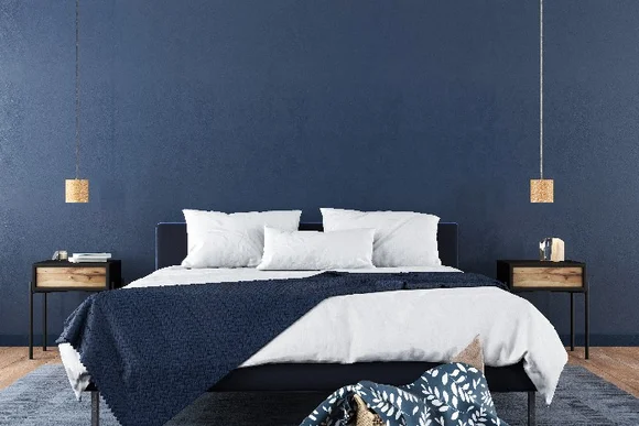 Modernes Schlafzimmer mit blaugrauer Wand